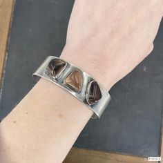 "This beautiful Modernist Scandinavian bracelet was made by Finnish studio Kasityo around 1960 and features three high relief polished quartz cabochons bezel set in 916 silver (Finnish standard). It's a really elegant piece and would look great in a stack! Measures 3/4\" width. Interior measurements 2 3/8 x 2\". Opening 5/8\" wide but this cuff is flexible and will stretch up to 1\". Stamped \"KASITYO\" with full Finnish hallmarks for 916 silver and 1962 date mark. Weighs 36.8 grams. In overall Modernist Polished Cuff Bangle Bracelet, Modernist Cuff Bracelet With Polished Finish, Modernist Polished Cuff Bracelet, Modernist Polished Cuff Bracelet For Formal Occasions, Adjustable Modernist Cuff Bracelet With Polished Finish, Contemporary Polished Cuff Bracelets, Contemporary Polished Cuff Bracelet, Contemporary Cuff Bracelet With Polished Finish, Modern Adjustable Cuff Bracelet For Collectors