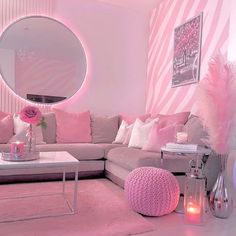 a living room with pink and white decor