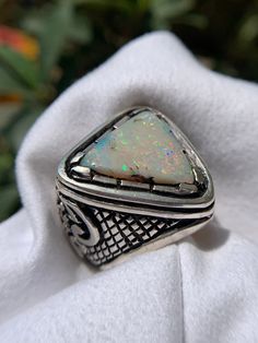 A  Pin Fires Rainbow Triliion Cut Splendid Austrailian White Opal In Hand Made Heavy Classy Silver Ring 💎 Name: Natural Opal 💎 Weight :7.75  Carat  Total Ring Weight: 33.15 Gram  💎 Origin :   Australia 🇦🇺  Ring Material:Hand Made Heavy Silver Ring 🔬Clarity: 📏 dimension: 🧪 Treatment: None 🧾 Certificate :On Demand Returns Returns accepted with in 20 days. Return Policy : Return is acceptable with in  20 days after receipt   Buyer will be responsible for return shipping (with tracking number) cost Payment will only be transferred back within 3-5 business days after making sure the items are not damaged Pack items in the same manner as it was received Goods Lost in Route : Customer is protected and will be refunded 100% amount  with in 05 business days. Purchase with confidence. Custo Fire Monster, Ring Name, Fire Rainbow, Opal Ring, Natural Opal, White Opal, Opal Rings, Wedding Rings Engagement, Silver Ring