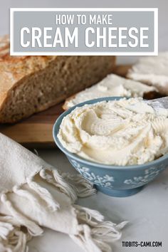 homemade cream cheese in a blue bowl next to bread