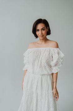 We can't resist an eyelet top! Feminine charm Embroidery along neckline and cuffs 100% cotton Can be worn on or off the shoulder Cinching around neckline and hem Model is 5'5" and wearing a size small. Small: 2-4 Medium: 6-8 Large: 10-12 Spring Cotton Off-shoulder Top With Ruffles, Spring Cotton Off-shoulder Top, Chic Off-shoulder Cotton Blouse, White Feminine Off-shoulder Top For Day Out, Feminine Off-shoulder Cotton Top, Cotton Off-shoulder Top For Day Out, Off-shoulder Peasant Top For Summer Days Out, Summer Feminine Off-shoulder Peasant Top, Chic Cotton Eyelet Blouse