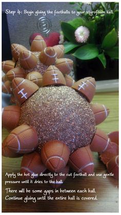 an image of a football decoration made out of balls and glitters on top of a table