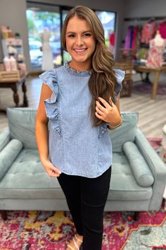 Introducing the BELLE Denim Ruffle Top - perfect for those who want to add some flair to their wardrobe! Featuring a high ruffle mock neck and playful ruffle sleeves, this top is made from high-quality denim material. The keyhole back detail adds a touch of charm. Dress it up or down for a versatile and stylish look. It pairs perfectly with white slacks and can be worn all year long! This one has no stretch. Wash separately. Hang to dry. No bleach. Material: 100% Cotton Small 2/4 Medium 6/8 Larg Charm Dress, White Slacks, Candles For Sale, Denim Material, Ruffle Sleeves, Ruffle Top, Mock Neck, Bleach, Boutique