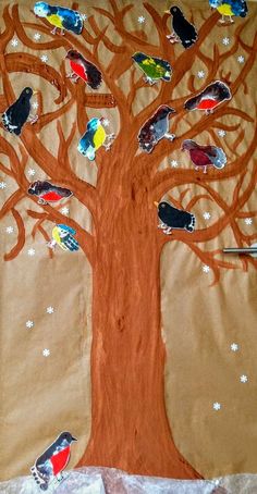 a tree with many birds painted on it