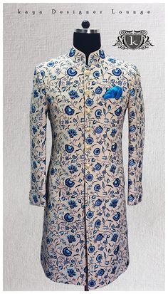 a man's coat with blue flowers on it