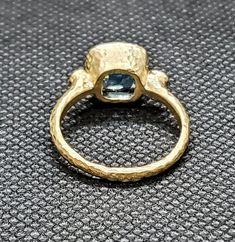 14k solid yellow gold hammered ring with 0.17 ct. SI1, G color natural brilliant diamonds & 2.50 ct. 8x8 mm cushion shape natural AAA London blue topaz. This item can also be ordered in white or rose gold with different color gemstones such as, amethyst, pink amethyst, green amethyst, Swiss blue topaz, white topaz, garnet, citrine, smoky quartz, peridot, aquamarine, pink tourmaline, tanzanite & morganite, please contact me for a quote as each gemstone varies in price. I am a manufacturer Gold Jewelry With Rose Cut Diamonds And Blue Topaz, Unique Gold Ring With Blue Topaz, Unique Gold Blue Topaz Ring, Blue Topaz Ring With Single Cut Diamonds For Anniversary, Fine Jewelry Gold Diamond Ring With Blue Topaz, Yellow Gold Hammered Diamond Rings, Hammered Yellow Gold Diamond Rings, Fine Jewelry Blue Topaz Rings With Single Cut Diamonds, Gold Jewelry With Blue Topaz Stamped 14k