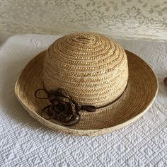 "Vintage Fedora Straw Hat. Crocheted Raffia Brown Flower With Center Beads and Leather Band and Decorative Loops. Well Made Straw Hat. This hat is in great shape. It is well made and lightly used. Dimensions: 12 5/8\" across hat brim 5\" From Brim to Top of Crown 22 1/2\" Around Crown For other hats, jewelry and vintage items see: www.VeryVictorianStudio.etsy.com For sewing related items see my other shop: www.SewingRoomStore.etsy.com Thank you for looking!" Adjustable Bohemian Sun Hat With Flower Shape, Bohemian Adjustable Sun Hat With Flower Shape, Bohemian Flower Shaped Sun Hat For Beach, Bohemian Flower Sun Hat For Beach, Adjustable Bohemian Flower Sun Hat, Bohemian Adjustable Flower Sun Hat, Adjustable Flower Straw Hat For Beach, Handmade Adjustable Crochet Hat With Flower Shape, Adjustable Brown Handwoven Crochet Hat