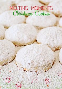 some cookies are sitting on a table with the words melting moments christmas cookies in front of them