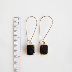 Where the timeless elegance meets modern vibes, that's where you'll find these drop earrings. GEMSTONE: Black Onyx CLOSURE: Gold plated kidney ear wires LENGTH: 2" long Adjustable Elegant Linear Earrings For Everyday, Elegant Everyday Adjustable Linear Earrings, Elegant Adjustable Hoop Earrings With Ear Wire, Everyday Adjustable Nickel-free Threader Earrings, Everyday Long Drop Earrings With Ear Wire, Minimalist Black Earrings For Everyday, Black Minimalist Everyday Earrings, Black Teardrop Brass Jewelry, Modern Black Jewelry With Ear Wire