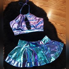 Holographic Strappy Halter Crop Top And Ruffle Mini Skirt Metallic Festival 2 Piece Set Women's Size Medium Perfect For Rave, Festival, Dancewear, Party, Sexy, Cosplay, Pin-Up, Boudior Photos, Dress-Up Nwot! Super Soft And Shiny! 80% Polyester 15% Cotton 5% Spandex Party Purple Ruffled Mini Skirt, Fitted Purple Skirt For Club, Party Mini Skirt With Ruffles In Purple, Fitted Purple Mini Skirt With Ruffles, Purple Party Skort For Spring, Holographic Rave Outfit, Rave Skirt, Ruffle Mini Skirt, Rave Festival