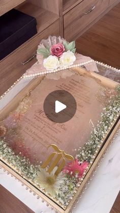 a cake with flowers on it sitting on top of a table