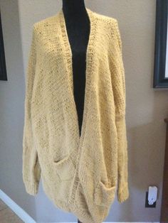 A hand knit woman's cardigan knitted in the softest alpaca yarn, it is lightweight but very warm and cozy slouchy soft long in a relaxed fit that you can wear every day over a T-shirt and jeans and boots, it is easy to wear, it fits a woman size large. But if you;like a loose fit a size medium will work as well.  The cardigan is 36 inches long. The sleeve measures 20 inches a front panel measures 16 inches and the back measures 41 inches from shoulder seem across.  This cardigan is meant to wear as a bulky slouchy item with the shoulder seam hanging below your shoulders to extend the length of the arms. I made this item by hand knitting months in a pet and smoke free environment I ship this item free priority mail the next business day. This cardigan is a one of a kind card again I've neve Cardigan Knitted, Alpaca Yarn, Mustard Color, Business Day, Lightweight Cardigan, T Shirt And Jeans, Fall Wardrobe, Jumpers And Cardigans, Keep Warm