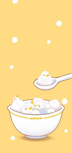 two spoons with some food in them on a yellow background and white polka dots