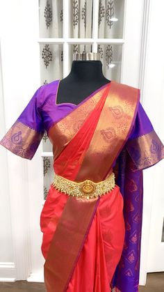 Elegant Kanchi Pattu saree with stitched blouse size 40 upto 44. fabric: kanchi semi silk color: coral red and purple Designer Red Paithani Silk Pre-draped Saree, Red Paithani Silk Pre-draped Saree With Unstitched Blouse, Red Pre-draped Saree With Unstitched Blouse In Paithani Silk, Fitted Red Saree With Tilla Detail, Red Katan Silk Saree With Unstitched Blouse, Red Saree With Unstitched Blouse In Traditional Drape, Designer Red Paithani Silk Traditional Wear, Red Saree With Unstitched Blouse For Puja, Red Blouse With Zari Weaving In Traditional Drape