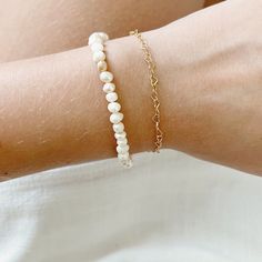 Every freshwater pearl bracelet is unique since every natural freshwater pearl varies slightly in shape, size, and color! Pearl is the traditional 3 year anniversary gift as well as the June birthstone! This beachy bracelet is adjustable from 6 to 8 inches, so you may able to wear it as an anklet as well! The extender is gold filled, so it is hypoallergenic & tarnish resistant for up to 30 years of everyday wear! All of my jewelry is shipped in 100% recyclable honeycomb mailers to protect your j Dainty White Hypoallergenic Bracelets, Dainty Hypoallergenic White Bracelets, Dainty White Hypoallergenic Bracelet, White Pearl Heart Bracelet With Pearl Charm, Minimalist Hypoallergenic White Charm Bracelet, Pearl White Oyster Bracelet As A Gift, Classic White Bracelets For Mother's Day, Elegant White Pearl Heart Bracelet, Delicate Beaded Oyster Bracelets For Gift