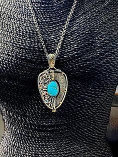 "Artisan Turquoise gemstone pendant Hand-made Sterling Silver 925. 24 k Gold. Stones used: Sleeping Beauty Turquoise, Citrine, Topaz Green&Pink Tourmaline. Height - 3 1/8\" (with bail), Width - 1 5/8\" Height -80mm (with bail), Width - 40mm Unique Handcrafted One-of a-kind Design Pendant Each Piece of Jewelry in my Collection is Absolutely One of a Kind! When you start wearing a piece of my jewelry you will fall in love with it more and more each day and feel that good Energy and Love that I Luxury Turquoise Pendant Necklace, Turquoise Multi-stone Pendant Necklace As Gift, Silver Multi-stone Turquoise Necklace Gift, Silver Multi-stone Turquoise Necklace As A Gift, Elegant Pendant Turquoise Necklace Collectible, Elegant Turquoise Pendant Necklace Collectible, Elegant Turquoise Pendant Necklace, Elegant Turquoise Necklace With Large Pendant For Gift, Sleeping Beauty Turquoise