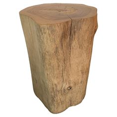 a piece of wood that has been turned into a side table or stool for sale