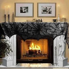 the fireplace is decorated with black lace and candles for halloween decorations, as well as an american flag