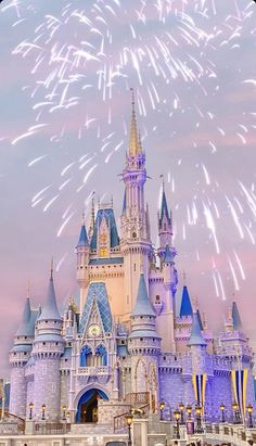 fireworks in the sky above a castle