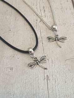 Lovely Dragonfly Charm Necklace Antique silver charm on either black waxed cord or silver plated curb chain The waxed cord is approx 18.5 inches long which includes the extension chain The silver plated chain is available in either 18 or 20 inch lengths Your necklace will be lovingly packaged inside an organza gift bag can be sent direct to the recipient if required, please leave a note at the time of checkout All items are posted free of charge via Royal Mail second class post the same or next working day I have many more necklaces and earrings for sale including a complete Dragonfly set which consists of matching earrings and necklace Please note overseas deliveries are taking longer than usual to arrive so please allow a delay in receiving your order. All orders outside of the UK are no Silver Necklaces With Adjustable Length And Waxed Cord, Silver Necklace With Adjustable Length And Waxed Cord, Silver Casual Necklace With Adjustable Length, Casual Silver Necklace With Adjustable Length, Minimalist Silver Necklace With Waxed Cord, Silver Waxed Cord Necklace For Gift, Silver Necklace With Waxed Cord For Gift, Adjustable Black Sterling Silver Charm Necklaces, Adjustable Black Charm Necklace