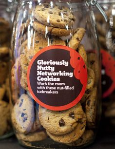 chocolate chip cookies in a glass jar with a label on the top that says gluciously not working cookies