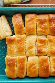 several pieces of bread sitting in a blue pan