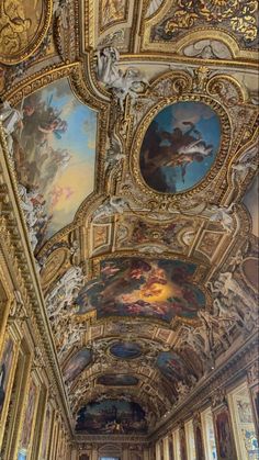 an ornate room with many paintings on the ceiling