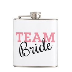 a flask with the word team bride on it in black and pink ink, is shown