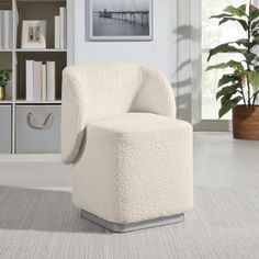 a white chair sitting on top of a carpeted floor