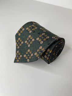 "Vintage Brioni tie Made in USA Length: 60\" Width: 4\" Material: 100% Silk" Classic Patterned Ties For Black Tie Events, Classic Patterned Suit And Tie Accessories For Black Tie, Patterned Standard Tie For Formal Occasions, Formal Green Ties, Green Formal Neckwear With Ties, Dapper Green Ties For Business, Green Dapper Ties For Business, Green Dapper Business Ties, Green Standard Tie For Semi-formal Suit Accessories