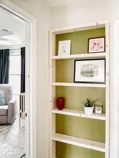 a living room filled with lots of furniture and decor on top of bookshelves