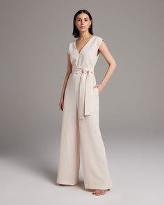 The V Neck Jumpsuit is a sophisticated and effortless silhouette for Spring. Featuring a double-v neckline and wide leg with an optional belt to accent the tapered waist. Made in New York City from light and airy blend of soft Viscose and Wool, this jumpsuit is perfect for a tailored look in the warmer weather. 69% Viscose / 31% Wool Made in New York City Dry Clean Only V Neck Jumpsuit, Cami Slip Dress, Tailored Jumpsuit, Free Spirited Woman, Bridal Jumpsuit, Wedding Jumpsuit, Luxury Dresses, Long Jumpsuits, Luxury Dress