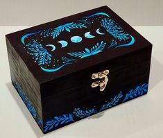 a wooden box with blue designs on it