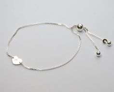 "Sterling silver initial bracelet, Sterling silver expandable heart bracelet This is a great gift. The bracelet will arrive in a nice box tied with a white ribbon. Sterling silver adjustable bracelet is about 8 1/2\" Sterling silver heart disc is about 7mm Sterling silver components To see other Flower girl jewelry click here: https://www.etsy.com/shop/SashJewelry?section_id=12354059&ref=shopsection_leftnav_8 To see Bridesmaid jewelry click here: https://www.etsy.com/shop/SashJewelry?section Silver Sterling Heart Bracelet For Personalized Gift, Adjustable White Gold Heart Bracelet, Silver Heart Charm Bracelet Adjustable, Adjustable Silver Heart Charm Bracelet, Adjustable White Gold Heart Bracelet For Mother's Day, Adjustable Silver Heart Bracelet For Valentine's Day, Valentine's Day Adjustable Silver Heart Bracelet, Silver Bracelets With Initials For Valentine's Day, Adjustable Silver Heart Bracelet Gift