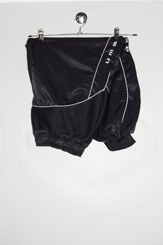 "Umbro track pants in black and side brand spell out embroidery. - Size tag: Please always check measurements before buying. Men's L-  Above ankle lenght, or Women's oversized/baggy style track pants. - Measurements (laying flat): Waist: 15\" stretches to 19\" Outleg: 33\" Inleg: 22\" Thigh: 13.5\" Rise: 13\" Leg opening: 4\"- 7.5\"  -Wear: /Please see images for details/ Good condition. Small red stain on the back as shown on the picture. - Fabric: Polyester Cotton *All of our items are preloved pieces so some signs of natural wear and age are to be expected. Please look through the photos carefully to check if the condition is to your satisfaction. *All efforts are made to show any defects however small imperfections may be missed. *We try to describe the sizes as accurately as possible, Sporty Streetwear Bottoms With Elastic Waistband, Sporty Elastic Waistband Bottoms For Streetwear, Athleisure Sweatpants For Streetwear, Athleisure Short Sweatpants For Streetwear, Athleisure Streetwear Short Sweatpants, Black Athleisure Parachute Pants With Elastic Side Panels, Black Streetwear Bottoms With Elastic Side Panels, Black Bottoms With Elastic Side Panels For Streetwear, Urban Bottoms With Elastic Side Panels For Streetwear