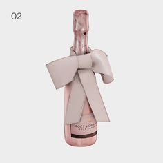 a bottle of champagne with a bow on it