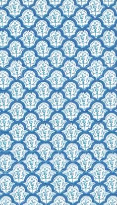 a blue and white wallpaper with circular designs