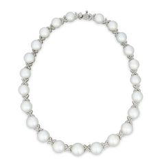 This classic necklace is the epitome of timeless elegance, with 23 exquisite South Sea pearls artfully interspersed with diamond-encrusted criss-cross motifs. South Sea pearls are among the largest and most coveted pearls in the world, and the examples in this exquisite strand necklace can be counted among the finest of their kind. The perfectly matched, graduated gems measure 10.5mm to 13.5mm, and each exhibits an exceptional luster. For added brilliance, 199 white brilliant cut diamonds, total Most Expensive Pearl, Pearl Oyster, Rare Pearls, Pearl And Diamond Necklace, Oyster Pearl, Diamond Choker, Classic Necklace, Sea Pearl, South Seas