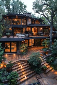 a large house with stairs leading up to it's second story and lots of windows