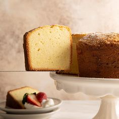 a piece of pound cake on a plate with a slice cut out and ready to be eaten