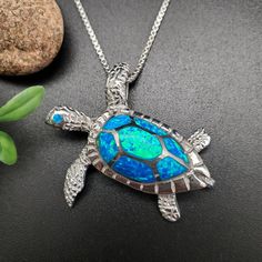 Visit our online shop at: Etsy.com/shop/925ForHer *sterling silver necklace pendant / sea turtle *small pendant with the option to buy a silver box chain necklace 16, 18, or 20 inches *southwestern jewelry *Blue opal / lab created / inlaid opal *calibrated pre-cut stones: inlaid  opal *back of jewelry items are all covered / do not show the back of stones *all jewelry items are made to ship, slight variations in stones will occur compared to pictures. *size of a penny is 19mm or a dime is 18mm in diameter for comparing the size with jewelry items. *free small convenient gift box *free shipping in the US, shipping from the US without insurance. *most orders will be shipped same day or within 24 hours from the time of placing orders during USPS working hours. *seller provides one-time FREE U Silver Turtle Necklace For Gift, Turtle Shaped Sterling Silver Jewelry Gift, Sterling Silver Turtle Jewelry Gift, Sterling Silver Turtle Necklace For Gifts, Sterling Silver Turtle Necklace For Gift, Handmade Sterling Silver Turtle Jewelry, Handmade Turtle-shaped Sterling Silver Jewelry, Hawaiian Sea Turtle, Fire Blue