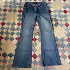 🌵Iconic mid rise y2k jeans from brand Angels in a nice medium wash with some big ol flares at the hem. I love the 2000s doing the hippie look and these are a quintessential look from that era. Branded on the back patch and large back pockets. Zips at the fly with a button at the waist. No stretch - please double check measurements as these do fit a medium rise.  🌵Condition: Great vintage condition, small frayed area on back of pant leg by hem. Please see photos. No other stains, rips holes or issues 🌵Material ❉ 100% Cotton 🌵 Size (measurements taken laid flat, double for body measurement): ❉ Will fit a modern size small, 28 inches at the low waist ❉ 14 inches at the low waist ❉ 19.5 inches at the hip ❉ 9.25 inch rise ❉ 31 inch inseam 🌵Return/Cancellation Policy (BY BUYING FROM MY STOR Y2k Style Dark Wash Mid-rise Flare Jeans, Y2k Mid-rise Denim Blue Flare Jeans, Y2k Style Medium Wash Wide Leg Flare Jeans, Y2k Style Dark Wash Cotton Flare Jeans, 90s Wide Leg Flare Jeans With Five Pockets, Y2k Dark Wash Flare Jeans, Y2k Flare Denim Jeans, 90s Style Medium Wash Wide Leg Flare Jeans, Y2k High Rise Flare Jeans With Five Pockets