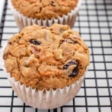 three muffins sitting on top of a cooling rack