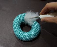 someone is using cotton to make a ring