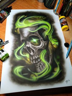 a drawing of a skull with green flames on it