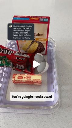 a plastic container filled with food on top of a white counter next to a sign that says, you're going to need a box of snacks