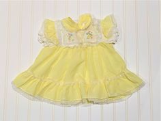 This is a beautiful vintage yellow dress with lace trim white bib collar. Two button closure on the back. This dress would be perfect for Easter, Church, or a picnic in the park. Anytime you want to show off your beautiful baby would be a time to wear this wonderful item. Made By: no name Size: 18 months *email me if you need measurements Cute Vintage Dress For Dress-up In Spring, Cute Vintage Dress For Spring Dress-up, Cute Summer Vintage Dress With Lace Trim, Cute Vintage Dress With Lace Trim For Summer, Summer Vintage Dresses For Playtime, Cute Vintage Dress For Spring Daywear, Cute Vintage Spring Dress For Daywear, Cute Vintage Summer Dress With Lace Trim, Vintage Dresses For Summer Playtime