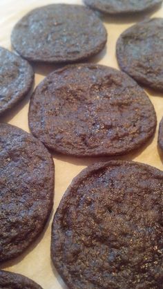 chocolate cookies sitting on top of a wooden table