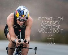 a bicyclist is riding in the rain with an inspirational quote on it