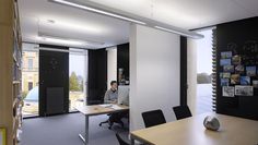 a man sitting at a desk in an office